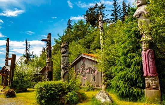 Native American Totems and Clan Houses at the Totem Bight State Historic Site in Alaska