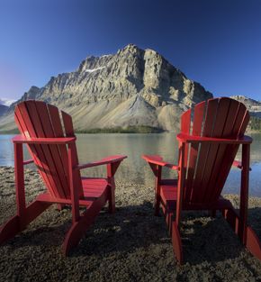 Two chairs looking across Bow Lake, Alberta