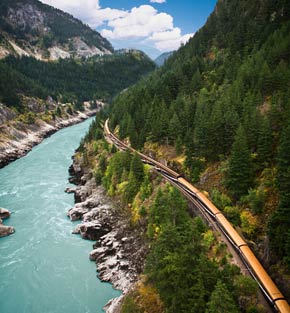 Rocky Mountaineer train travelling along a river