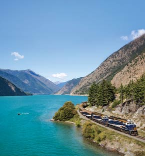 Rocky Mountaineer train passing by a lake