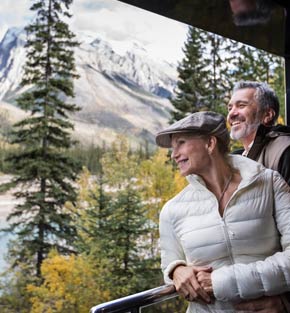 Couple on the viewing platform aboard Rocky Mountaineer