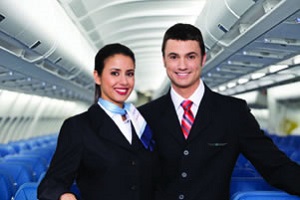 Two smiling flight attendants